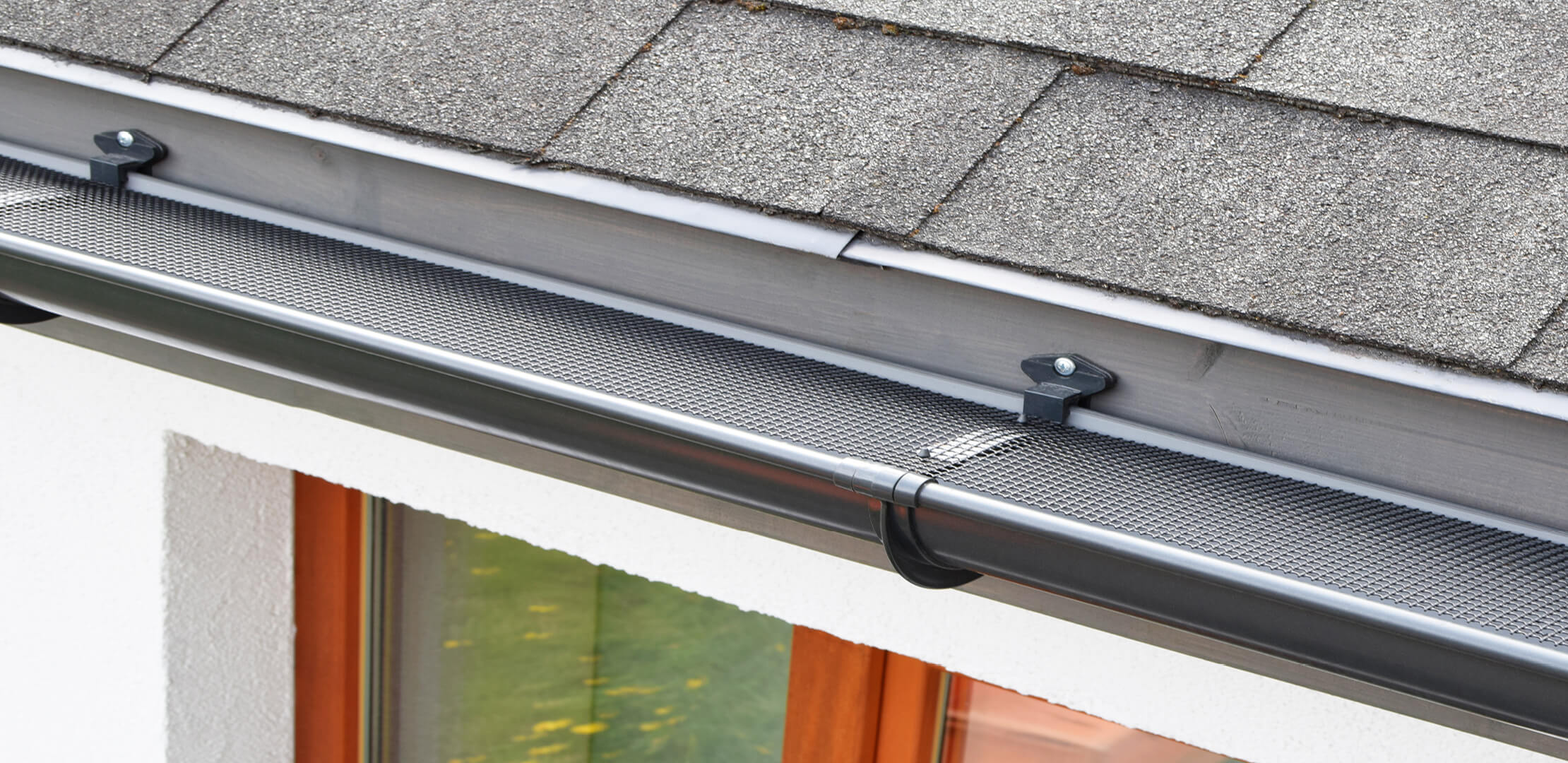 A gutter on a home with gutter guards