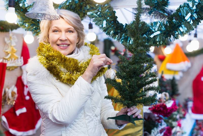 A senior woman with Christmas decorations