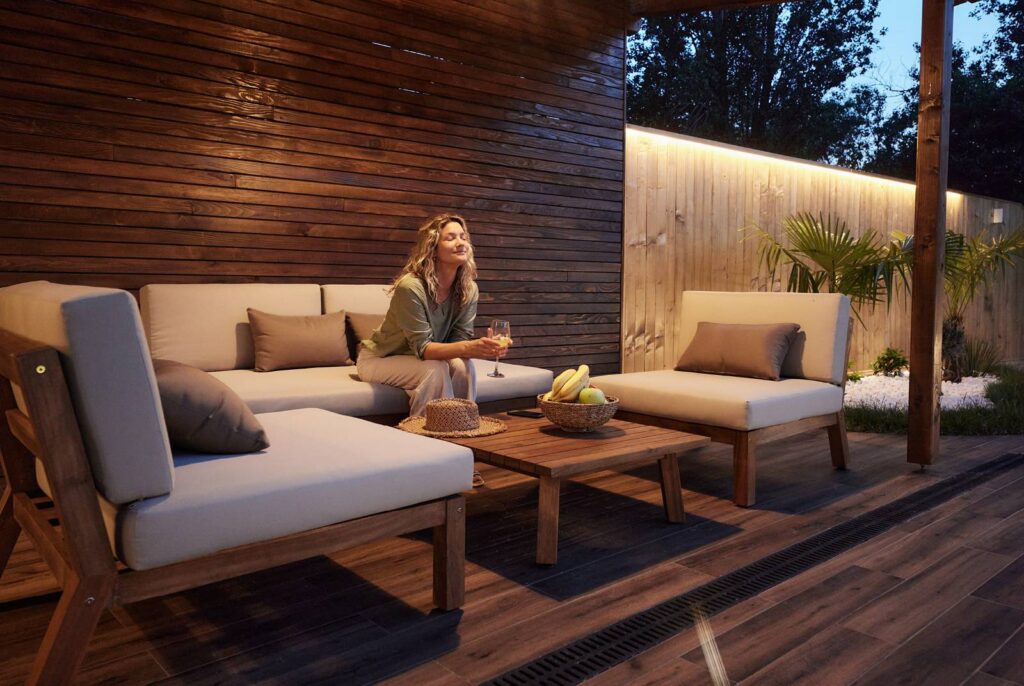 Woman relaxing on a luxurious deck at home