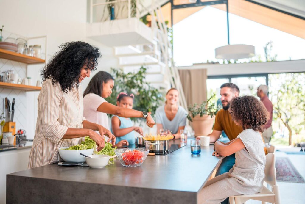 Family preparing a meal in an open concept kitchen