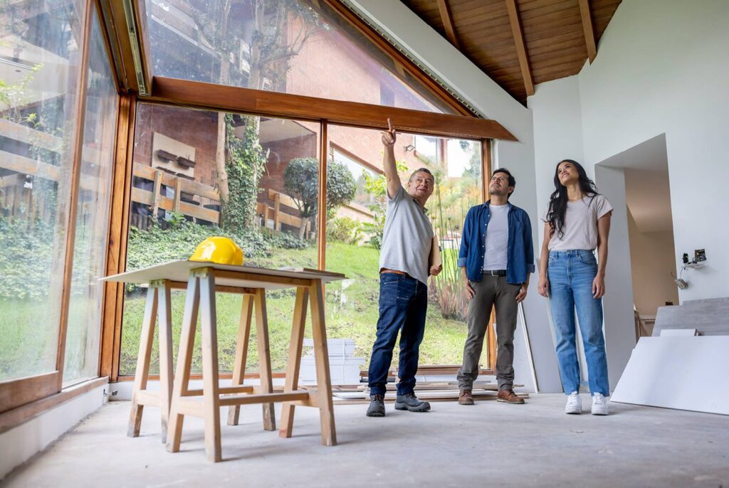 A couple with a Get Dwell  contractor discussing their remodeling project 