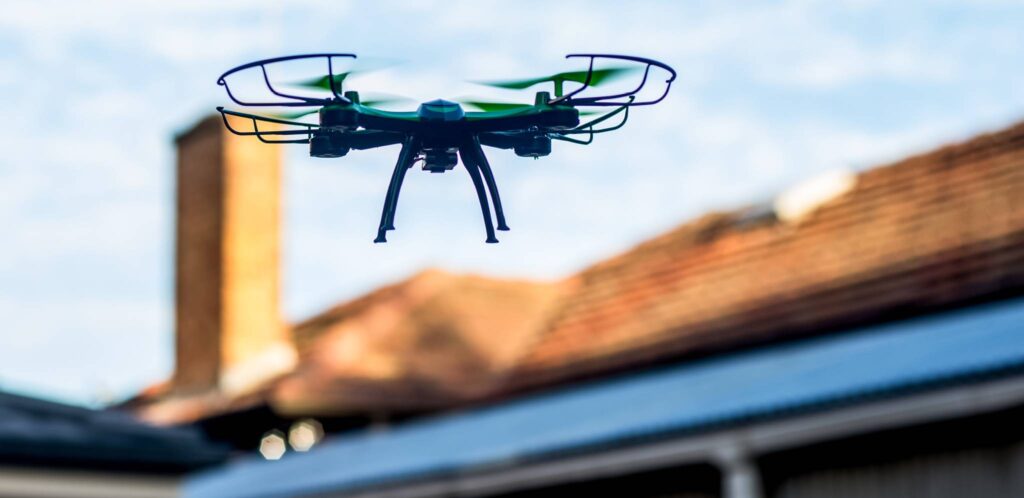 A drone camera creating a video map of a home's roof so the Get Dwell team can provide a roof assessment