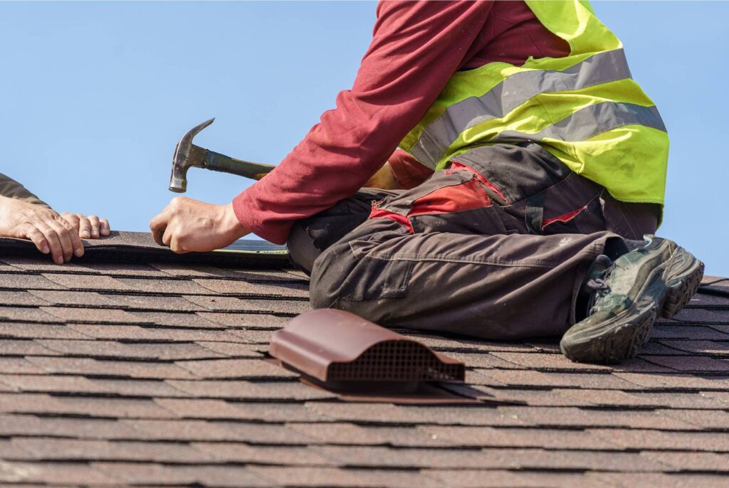 Get Dwell roofer repairing a shingle roof