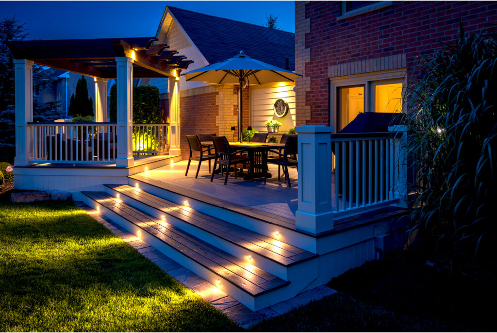 A beautiful composite deck with nice evening lighting